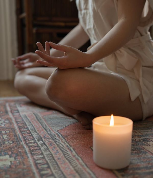 Woman in a calm yoga pose, embodying harmony and balance.